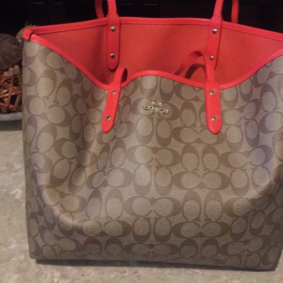 Coach Handbags - Coach reversible bag with matching orange pouch